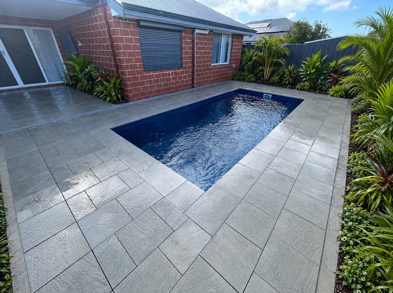 After — the finished Paradise Limestone backyard